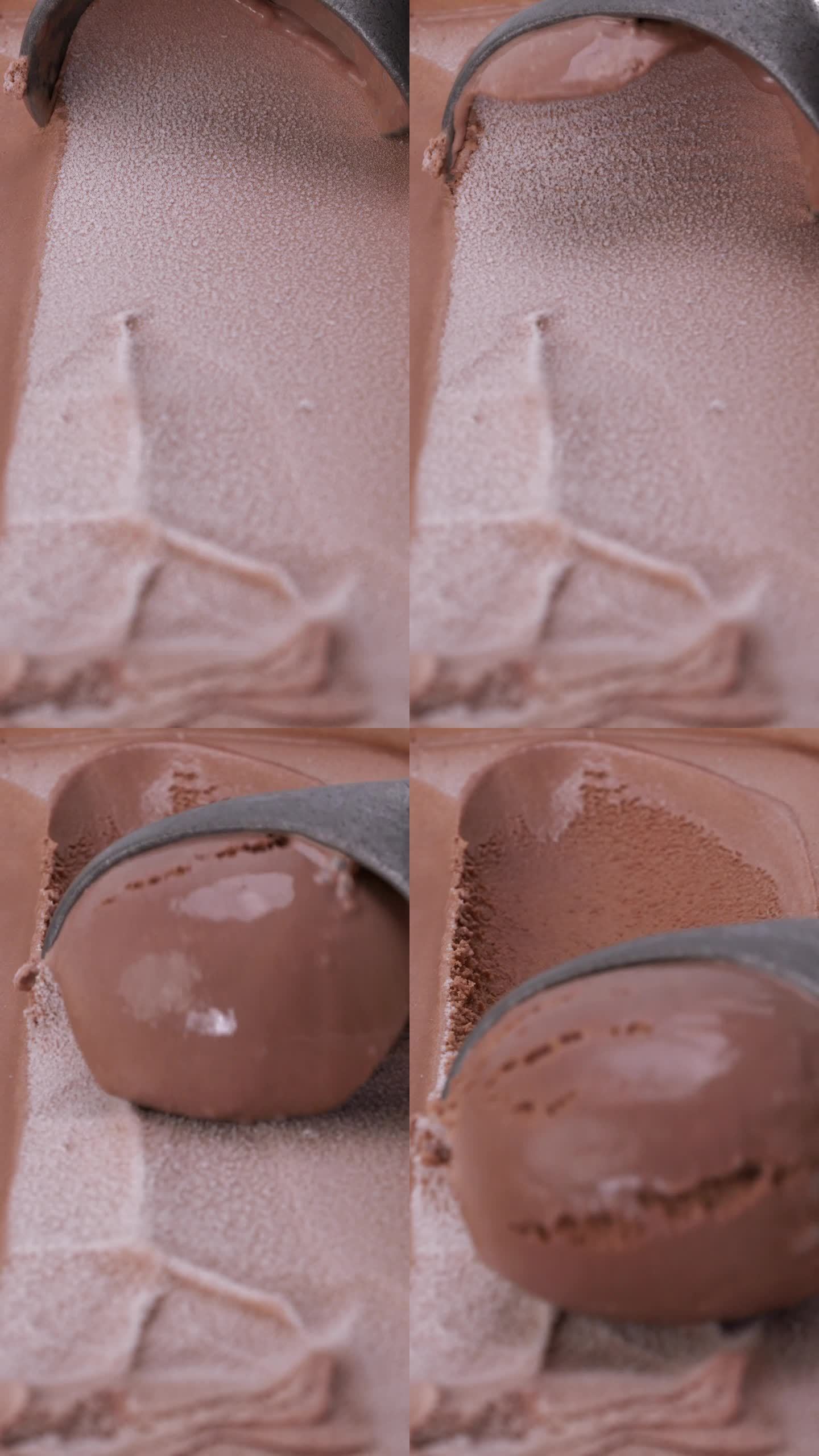 用不锈钢勺子舀巧克力冰淇淋。