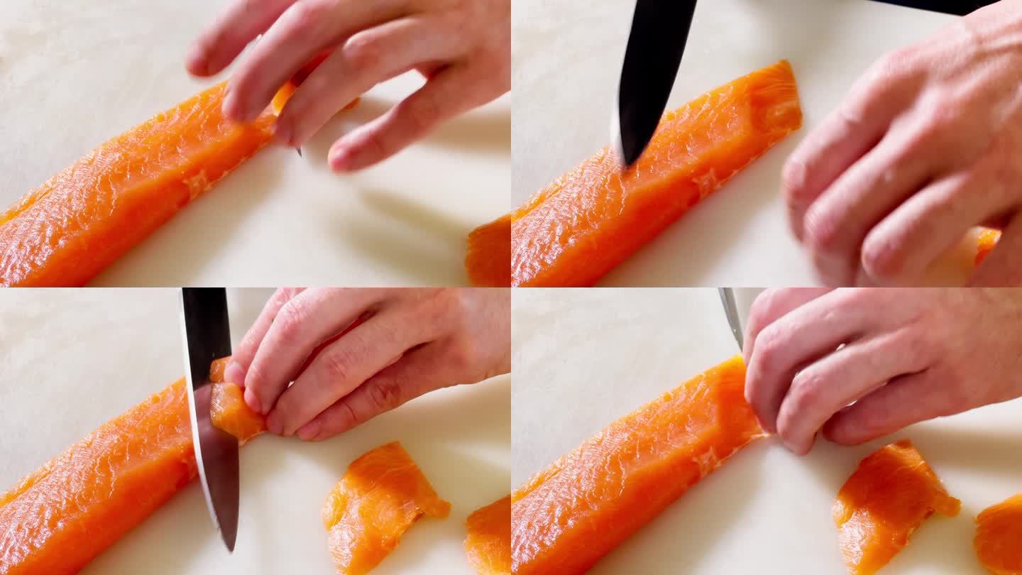 厨师用锋利的刀在白色砧板上切新鲜的大西洋鲑鱼片。专业职业，工作日，健康食品准备和餐饮业4K特写镜头。