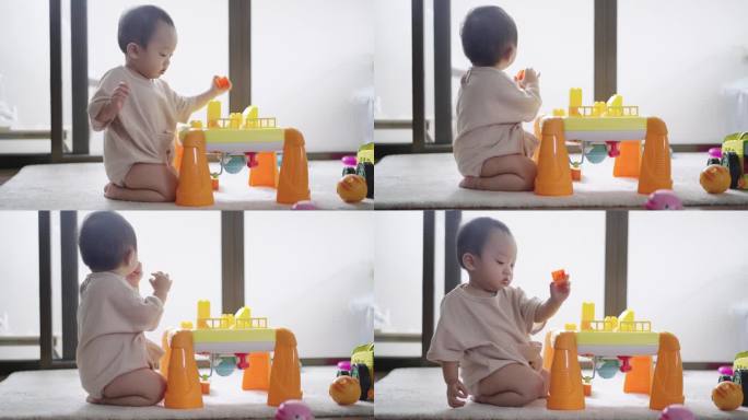 小男孩在家玩玩具搭积木玩耍可爱小宝宝室内