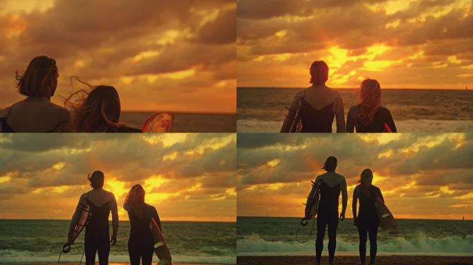 快乐的冲浪夫妇看着美丽的日落海景