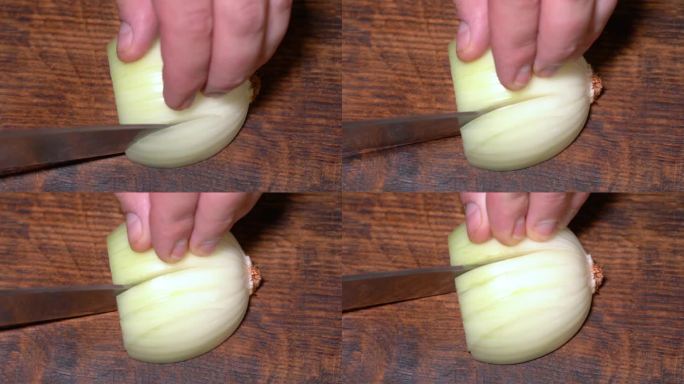 厨师在切菜板上切洋葱。高品质4k画面