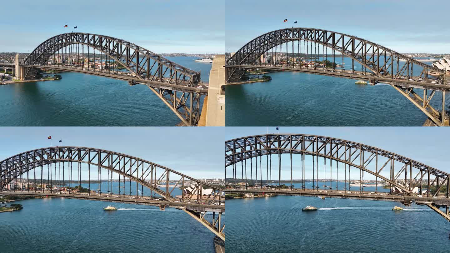 电影航拍镜头平移从悉尼海港大桥，桥下露出悉尼歌剧院，悉尼地标日落，澳大利亚。(Slowmo)