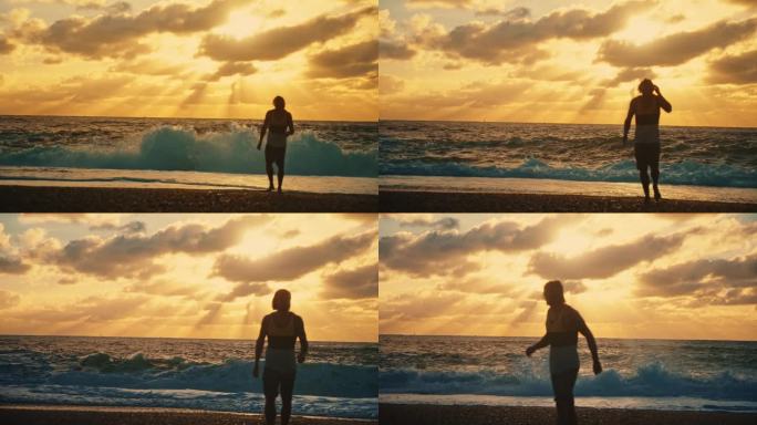 日落时分，一名男子在海滩上远离海浪