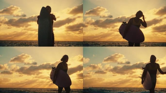 日落时分，男冲浪者在海边捡起冲浪板