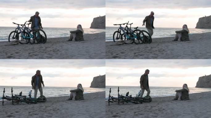 成熟的夫妇在空旷的沙滩上骑自行车放松