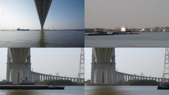 长江航运船在长江大桥底下穿过