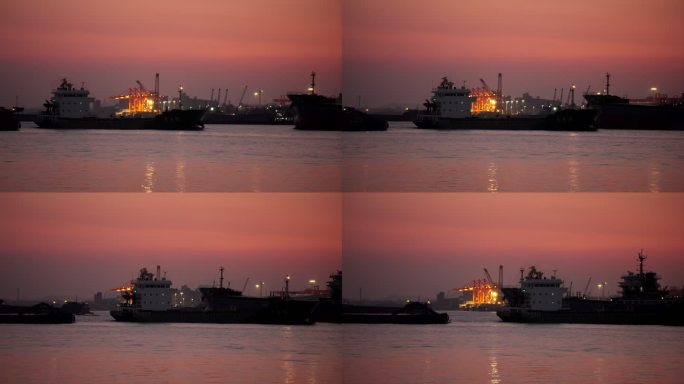 夜幕下江面海边码头上航行的货船