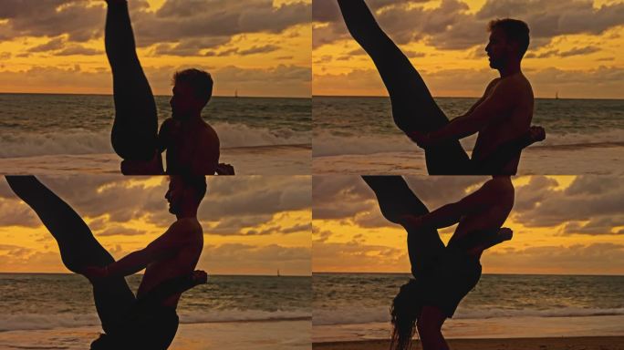一对冲浪夫妇在日落时在海边保持平衡