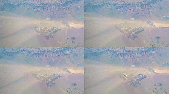 位于广阔的加利福尼亚沙漠中的太阳能农场的鸟瞰图，4k慢动作60fps