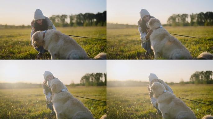 一个女人在草地上和一只金毛猎犬玩耍。抚摸和拥抱狗