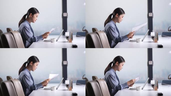 职业女性在办公室笔记本电脑工作喝咖啡