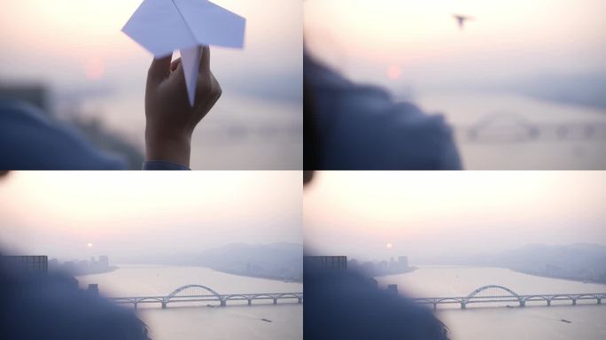 女性夕阳下飞纸飞机升格慢镜头