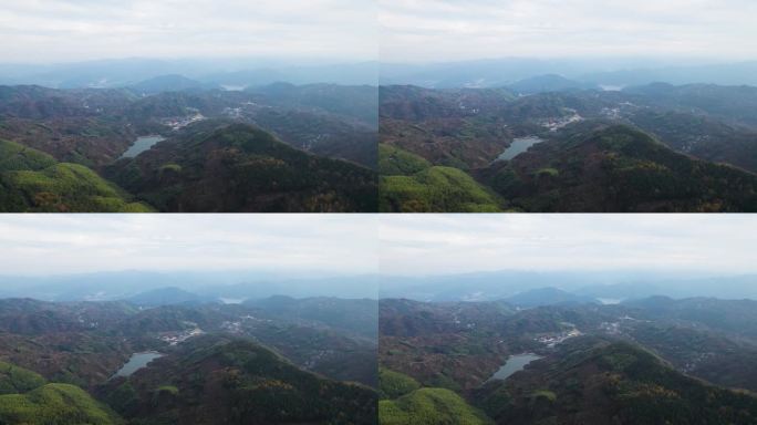 无人机在水库和大坝上飞行，在色彩斑斓的山脉中，高角度观看美丽的蓝色水域和丘陵，中国浙江省宁波。4k实