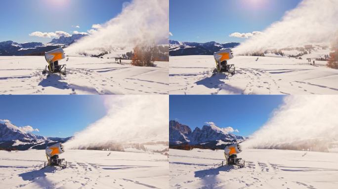 空中无人机拍摄的雪炮机吹雪在Alpe Di Siusi白云石蓝天下的晴天