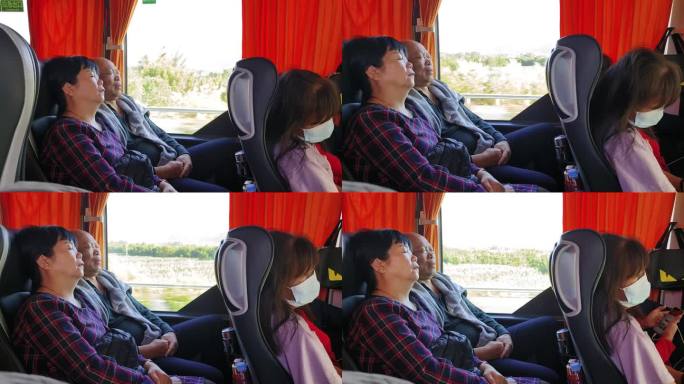 旅游在客车上休息大巴士困了睡觉的乘客游人