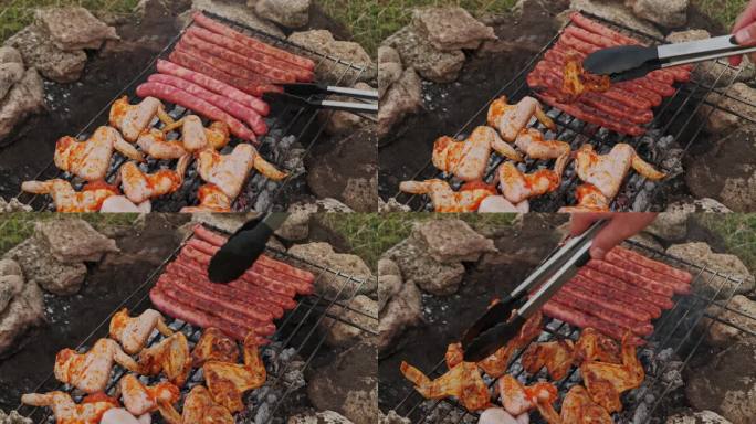 一名男子在野外烹饪香肠和鸡翅的近距离视频。