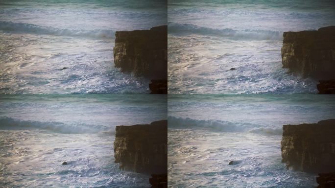汹涌的海浪翻滚着悬崖海岸。泡沫飞溅的海洋冲刷着岩石海岸