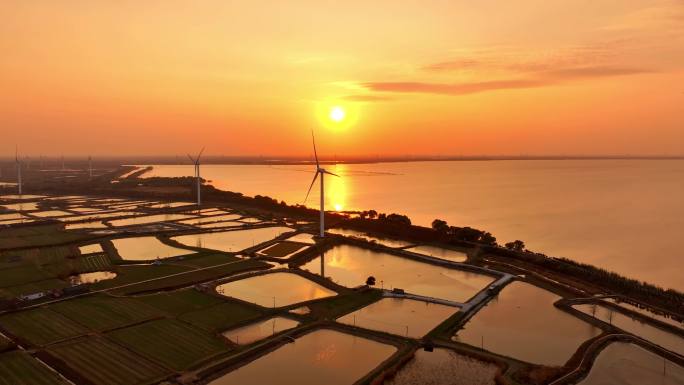 航拍高邮湖边风力发电夕阳晚霞堤岸鱼塘飞鸟