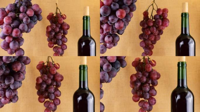 粗麻布背景上的葡萄和酒瓶。