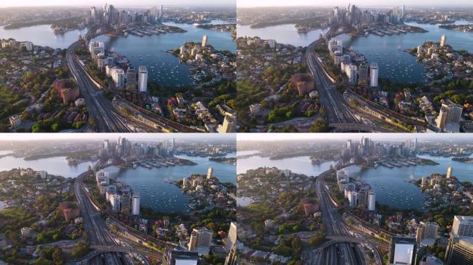 在一个阳光明媚的清晨，航拍无人机从悉尼市区、悉尼港和海港大桥向新南威尔士州拉文德湾反向拍摄