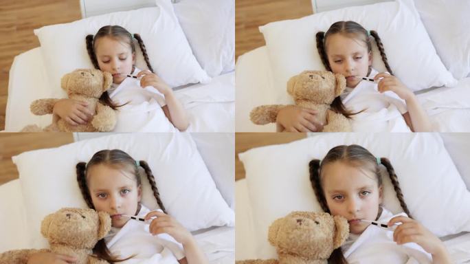 生病的女孩躺在床上，嘴里含着数字体温计