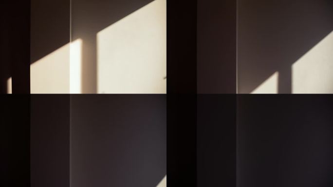 在黑暗的房间里，明亮的阳光和窗户的阴影出现在墙上，并不断改变位置，直到日落时房间再次变暗。