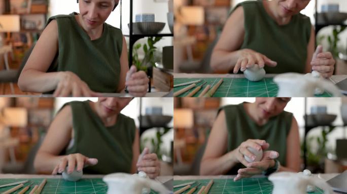 女雕刻家在家里的陶器作坊里制作泥塑