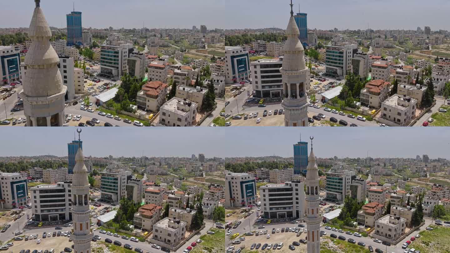 巴勒斯坦拉马拉市巴勒斯坦塔电影院、居民区和穆斯林清真寺尖塔。-空中回拉