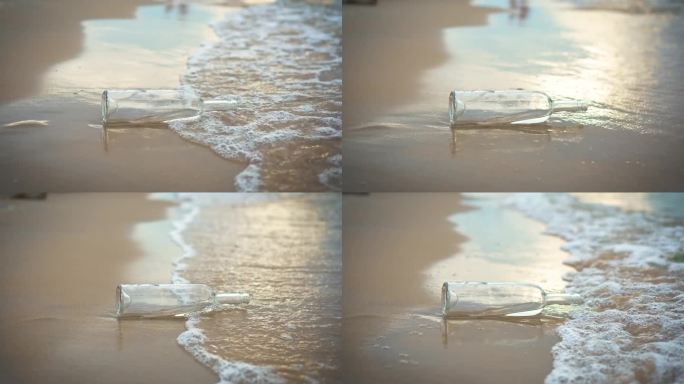 日落时分沙滩上的水里的空玻璃酒瓶
