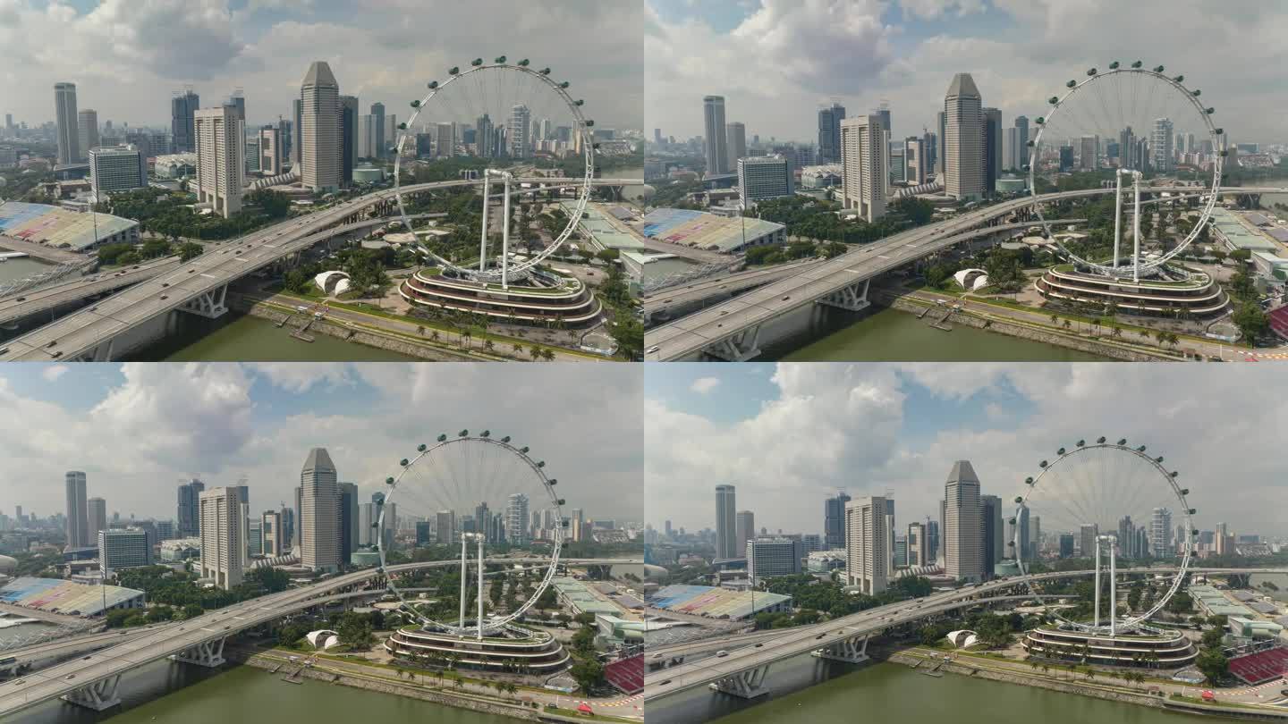 晴天新加坡市中心著名的摩天轮交通海湾路全景航拍全景4k延时拍摄