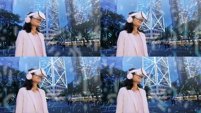 通过虚拟现实眼镜玩虚拟世界女商人站着，戴着眼镜在香港市中心的商业大楼之间导航虚拟世界