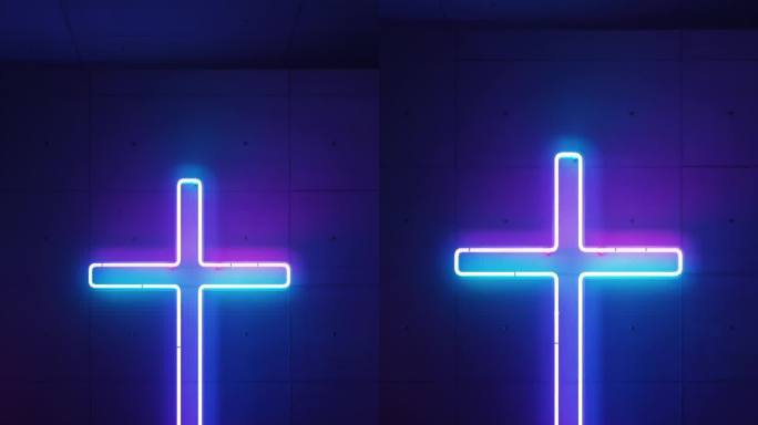 霓虹灯在教堂的外部塑造了一个发光的基督教十字架。