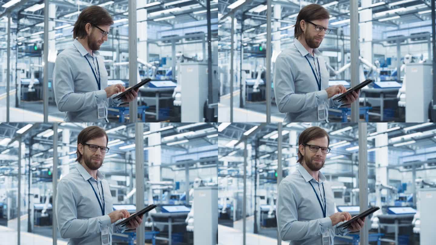 一个英俊的成年工程师的肖像，戴着眼镜，使用平板电脑，看着相机。穿着衬衫的技术人员在一家现代科技工厂里