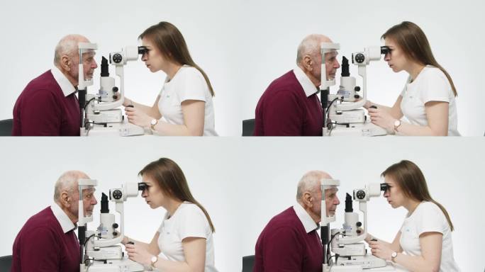 眼科医生用现代设备检查老人的视力。宣传眼科服务和医疗技术的理念。