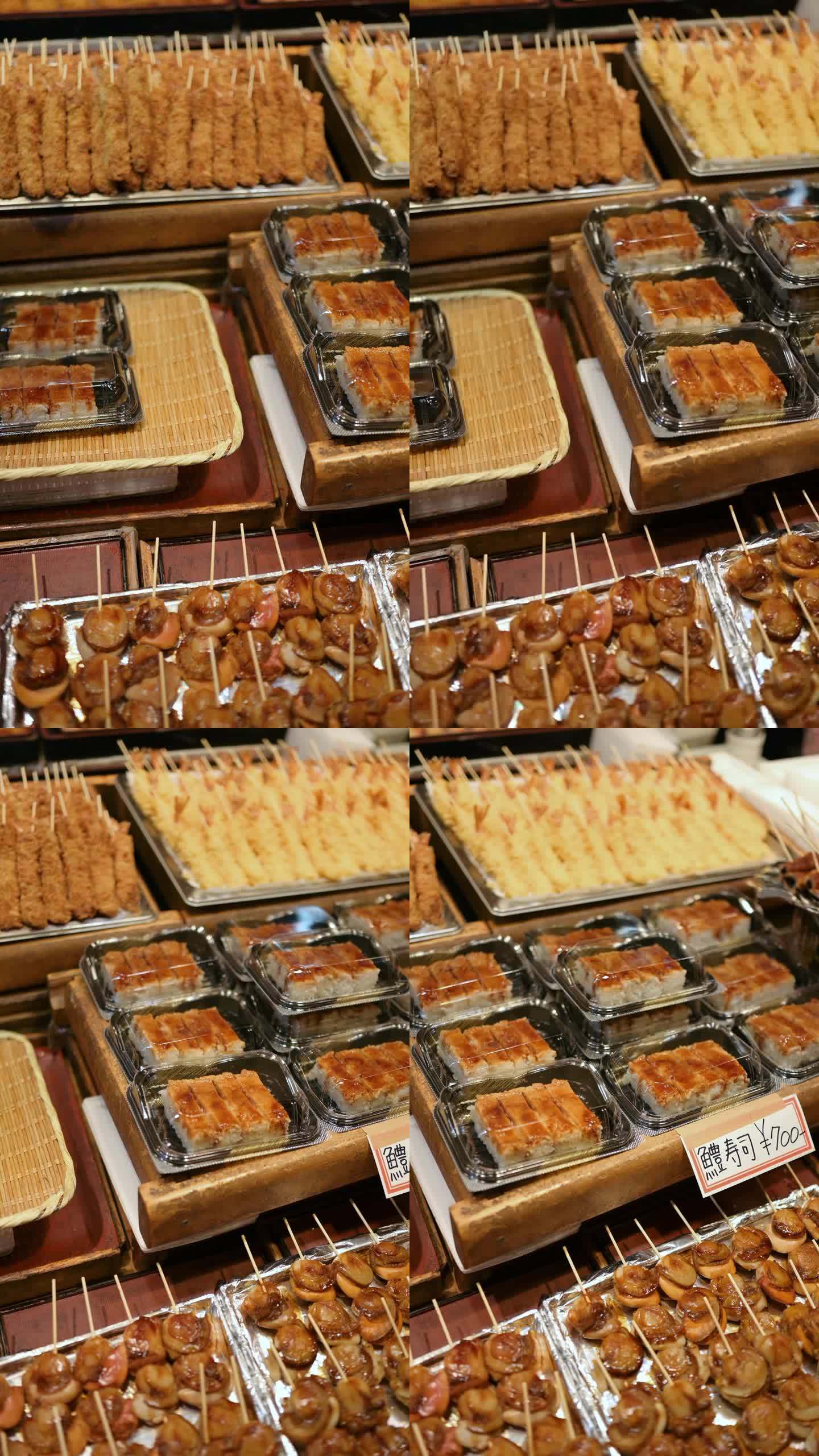 垂直视频准备吃京都街头小吃品种天妇罗腌制章鱼和烤鳗鱼串