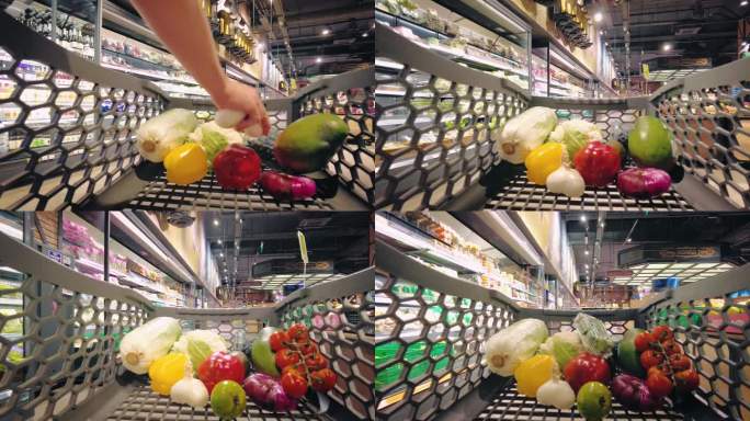 从购物车看到的景象。人们去购物，把食物放进购物车。蔬菜和浆果。为晚餐挑选食物