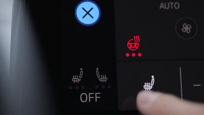 汽车座椅和方向盘加热控制面板的特写镜头。车内方向盘加热按钮。现代电动汽车控制面板与方向盘和座椅加热选