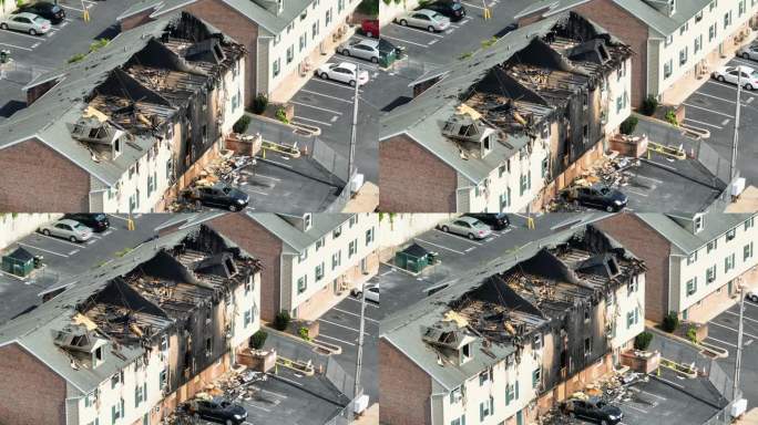 房屋火灾后的公寓楼。烧焦的外部和倒塌的屋顶的航拍照片。