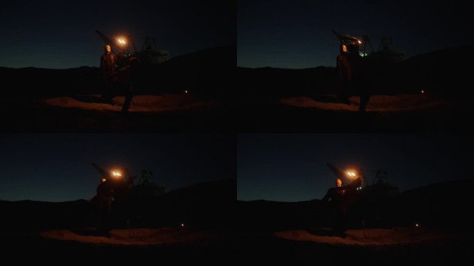 夜间户外跳跃的杂技演员剪影，慢动作，沙滩上的杂技和消防表演