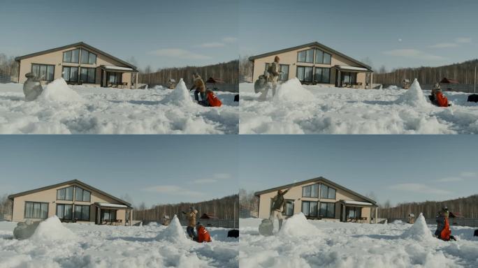 不同的孩子在自家后院打雪仗