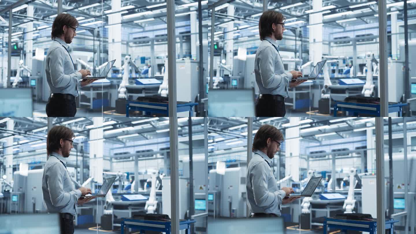 工厂经理在未来工业制造的笔记本电脑上工作，有自主支持机器人。专家监控计算机上的技术数据，分析报告和计