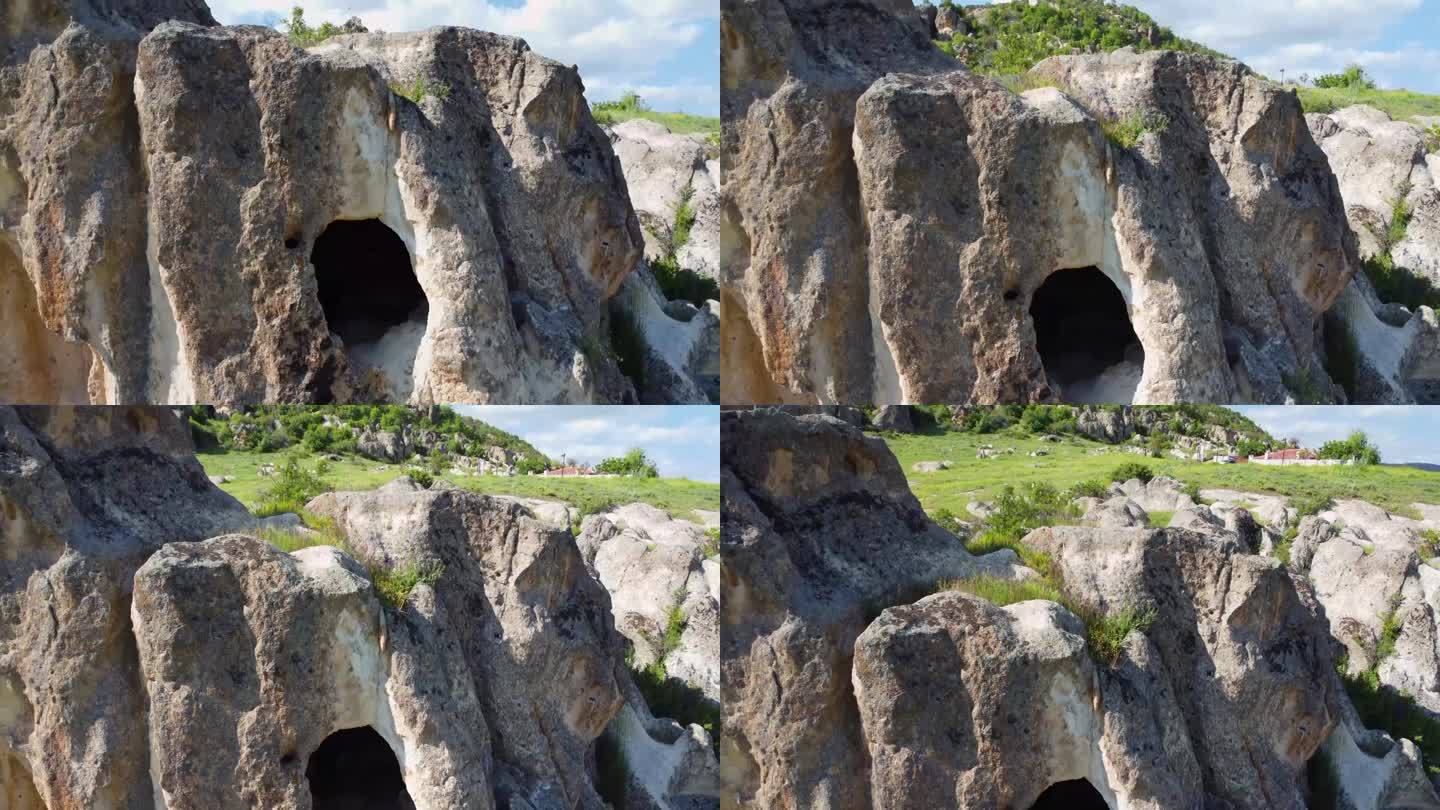 4k视频显示了古老的雕刻岩石和它上面的绿色区域