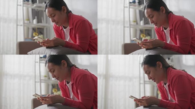 女性在家使用智能手机