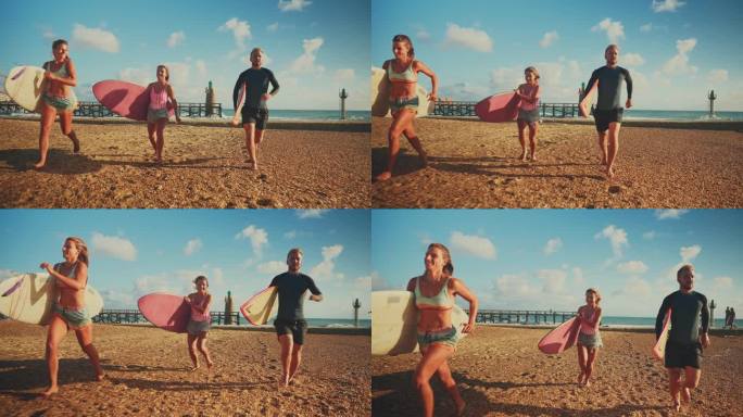 在阳光明媚的海滩上，无忧无虑的冲浪朋友们拿着冲浪板奔跑。跟踪拍摄无忧无虑的冲浪朋友在阳光明媚的海滩上