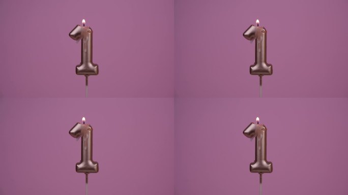 生日蜡烛燃烧在粉红色，1号。