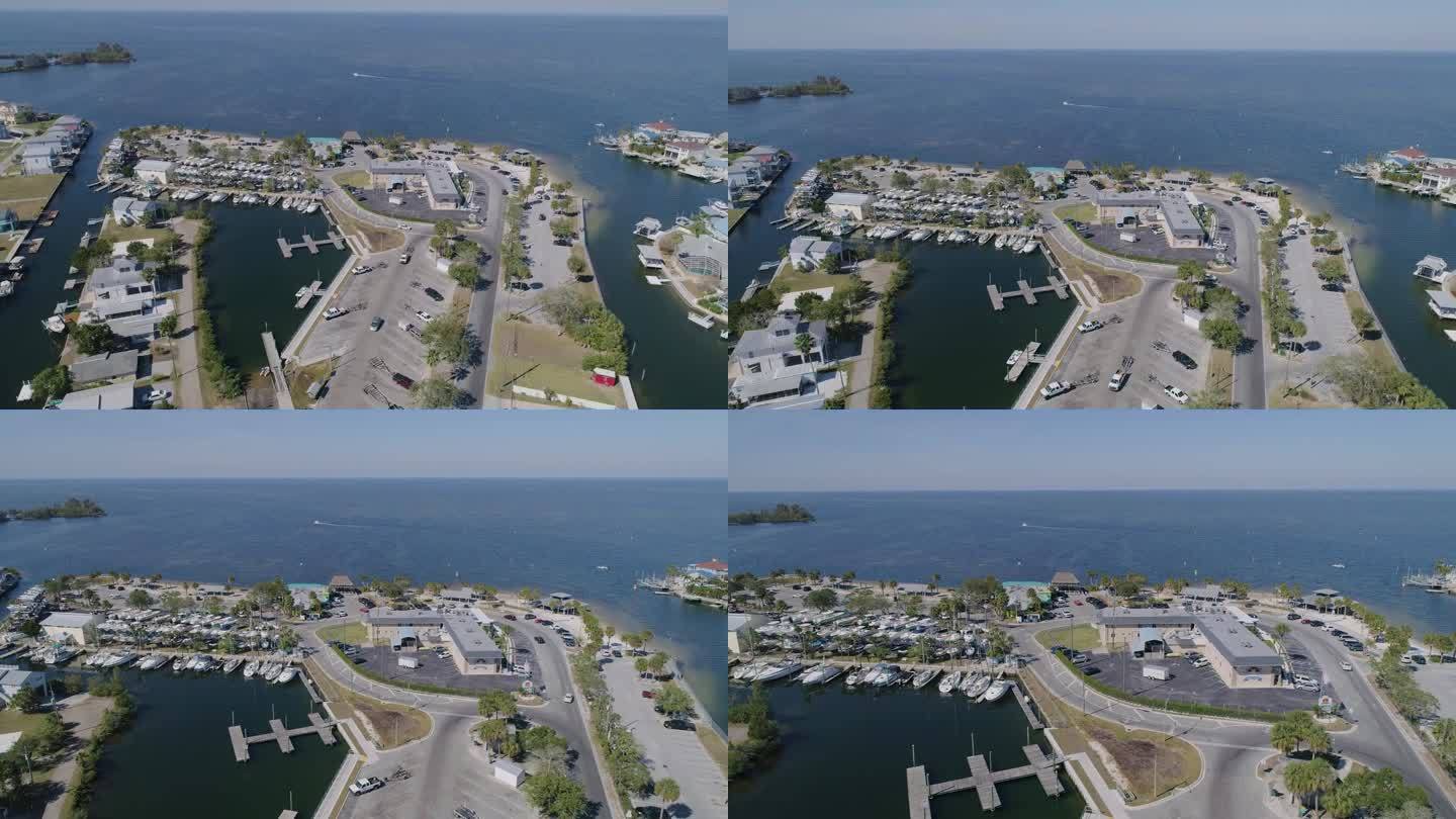 4K无人机视频(多莉拍摄)的海滩公园，码头，并在哈德逊海滩海滨住宅在墨西哥湾在佛罗里达州