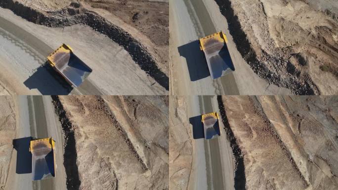 驾驶自卸车运输金矿坑开挖采石场挖出的矿石，慢镜头