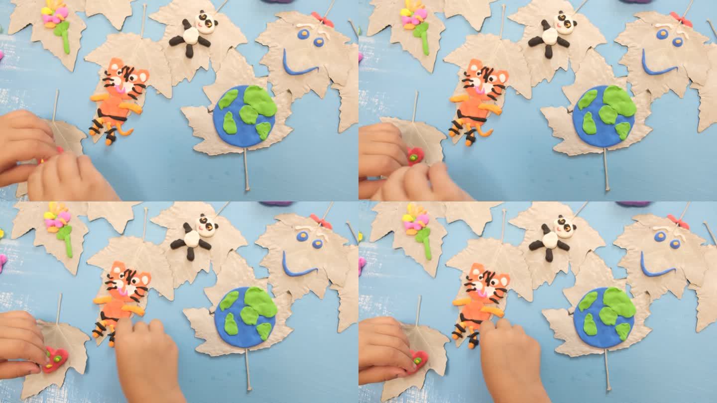 孩子们为地球日雕刻橡皮泥星球。保护环境，拯救地球。生态学的概念。艺术的学习和教育理念，拼贴