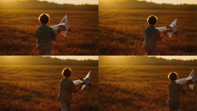 快乐的小男孩梦想着太空旅行和发现，在野外玩手工火箭
