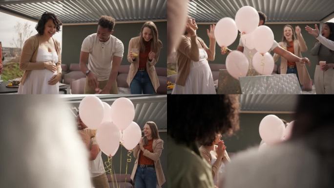 当一对深色皮肤的夫妇打开一个装有粉色气球的大盒子时，他们发现自己未来孩子的性别是女孩
